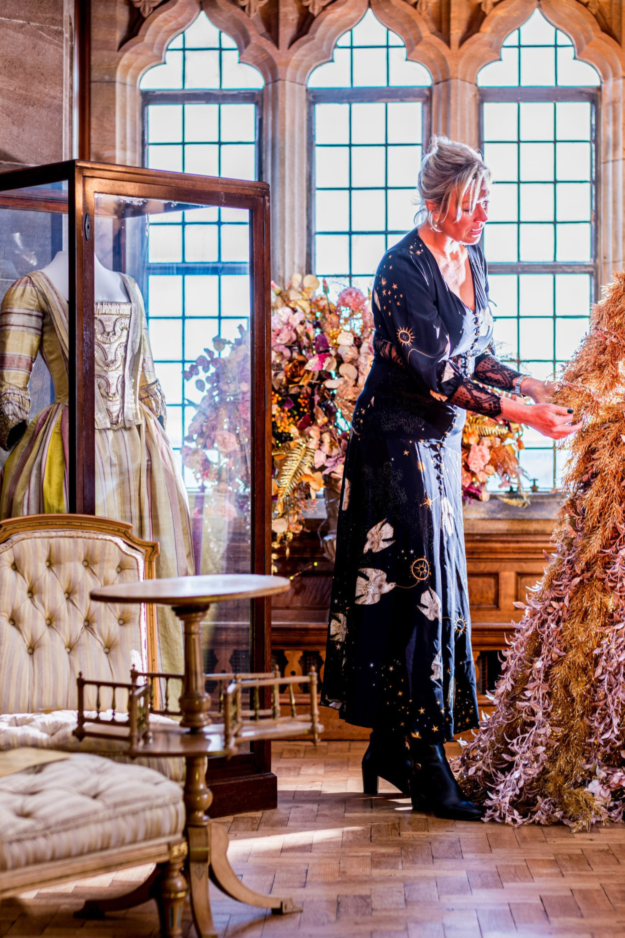 claire watson armstrong admiring a festive foliage dress