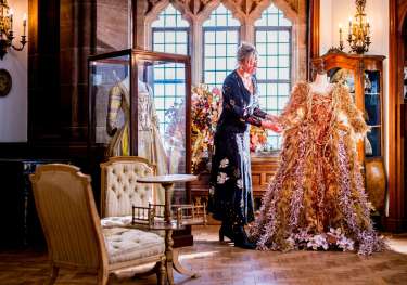 Claire watson armstrong admiring a festive foliage dress.