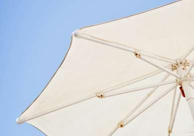 White parasols in blue sky.