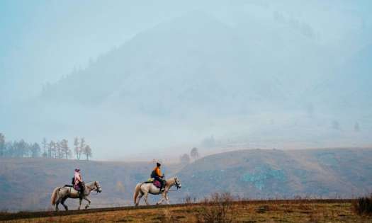 Horses riding in rural china.