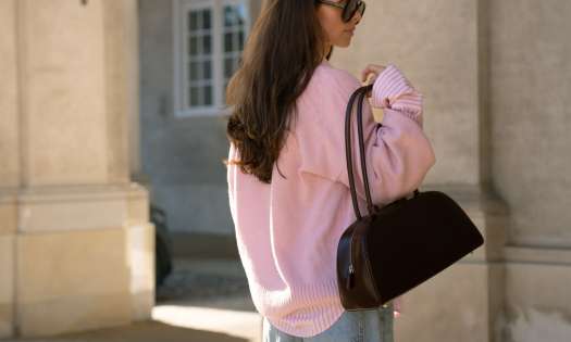 Maria kragmann posing with bag .