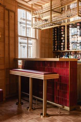 NAKIMUSHI bar area with red-leather stool .