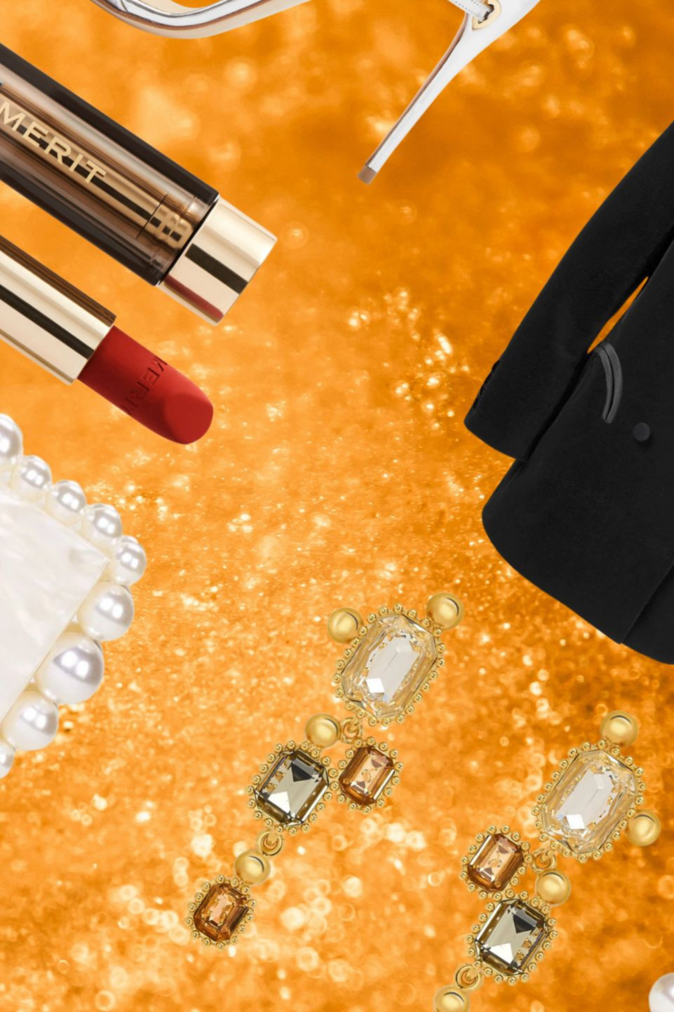 glam beauty and fashion items on gold glitter background