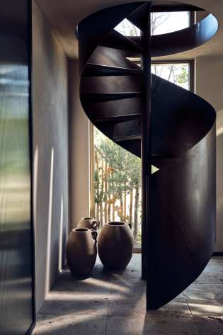 Curved wooden staircase in Greek resort.
