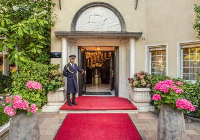 Entrance to villa eden retreat with red carpet .