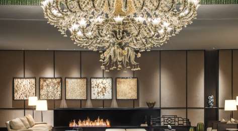 Hotel lobby with giant chandelier.