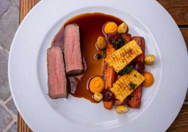 Entrecote dish on white plate.