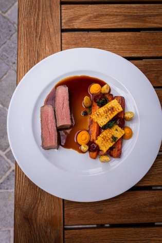 Entrecote dish on white plate.