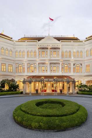 Exterior of hotel with driveway .