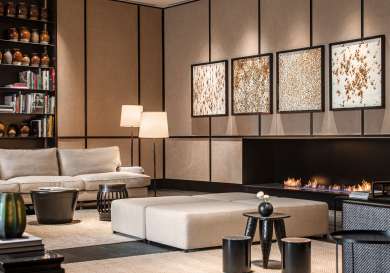 Hotel lounge with sofas and modern fire.