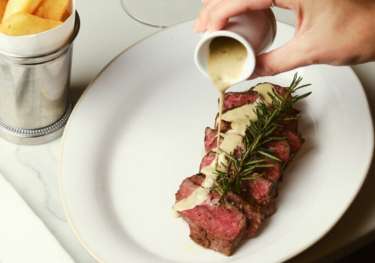 Flat iron steak 190 grams with chunky chips green peppercorn sauce scaled.