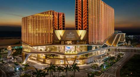 Hotel exterior at night.