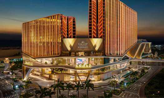 Hotel exterior at night.