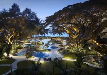 View of outdoor swimming pool at hotel .