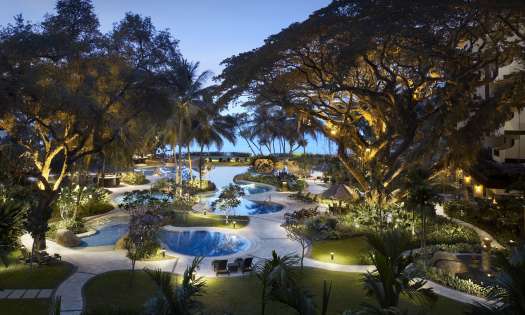 View of outdoor swimming pool at hotel .