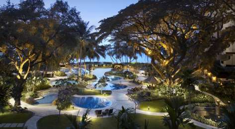 View of outdoor swimming pool at hotel .