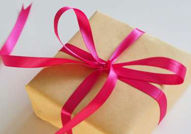 Gift wrapped in pink ribbon.