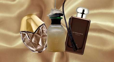 Trio of fragrances on silk background.