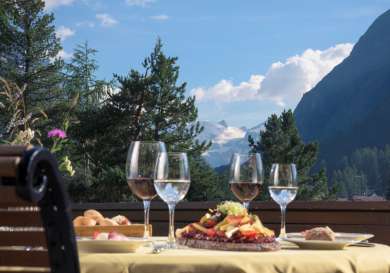 Grand hotel kronenhof   le pavillon meal with a view of val roseg.