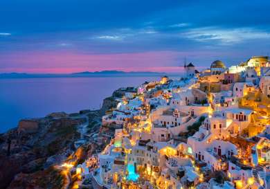 Greek island at sunset .