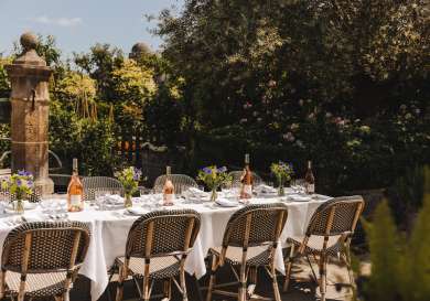 Rooftop terrace with table and chairs.