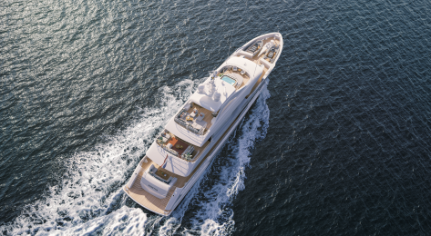 Aerial view of yacht sailing across sea .