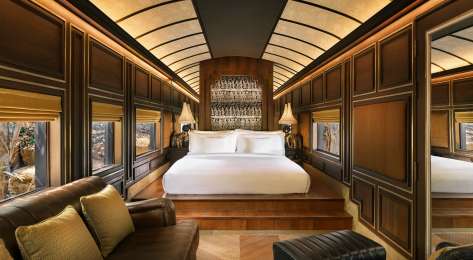 Hotel bedroom with wooden panelling.