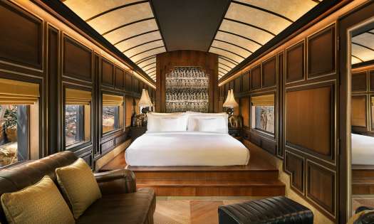 Hotel bedroom with wooden panelling.