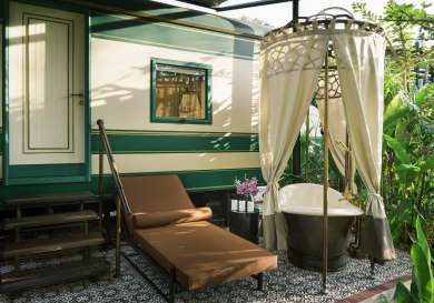 Outdoor bath tub with curtain .