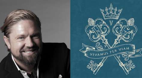 Headshot of adam von gootkin next to crossed keys brand logo.