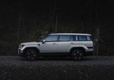 Photo of parked hyundai santa fe hybrid car.