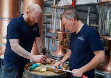 Iain robertson alasdair day filling the first cask credit scott mooney.