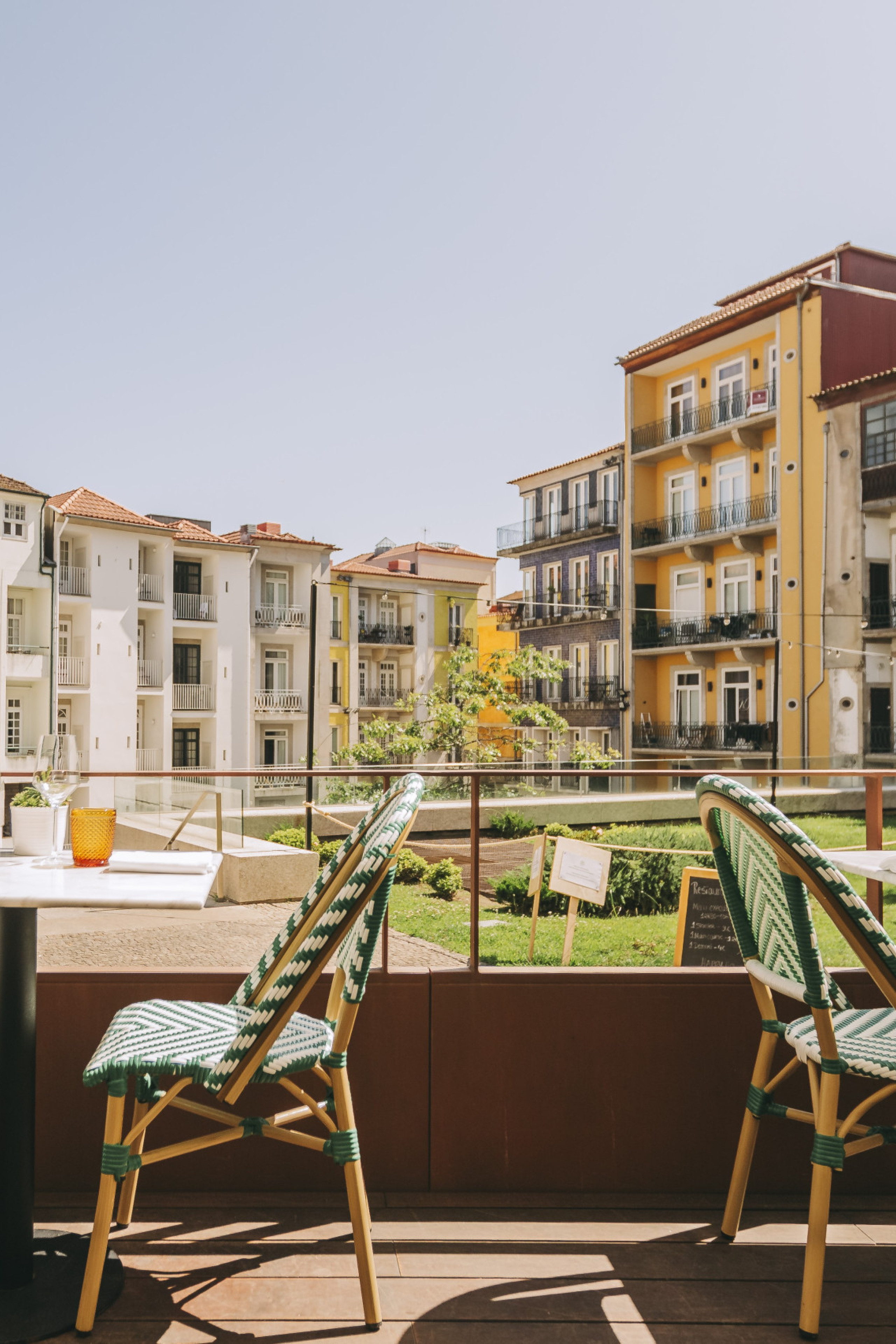 hotel terrace area in porto with tables and chairs 