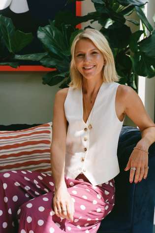 Headshot of philippa thackeray posing in polka dot trousers and white waistcoat.