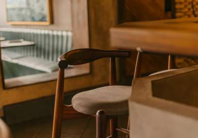 Cosy table area with a stool .