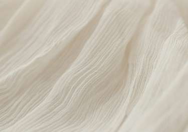 Gauzy cream fabric.