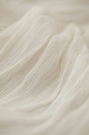 Gauzy cream fabric.