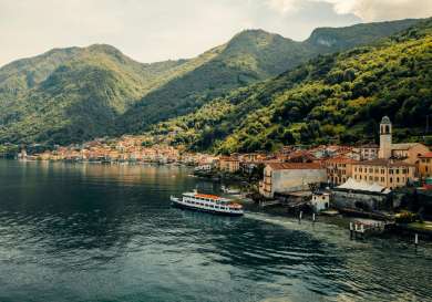 Lake como town with boat .