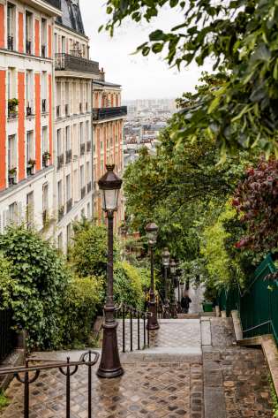 Steps in paris with lampposts .