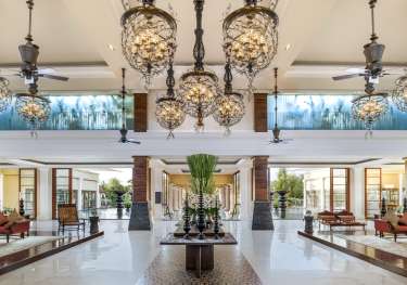 Hotel lobby with hanging lights.