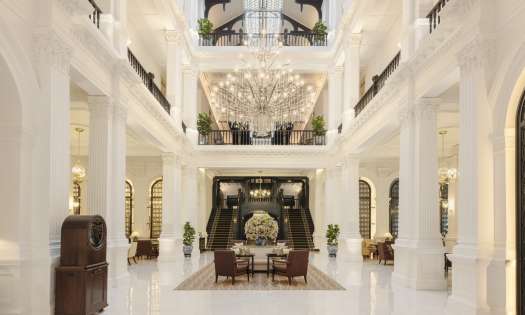 Lobby of hotel with chandelier.