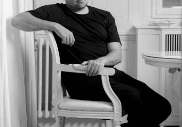 Black and white headshot of luke selby .