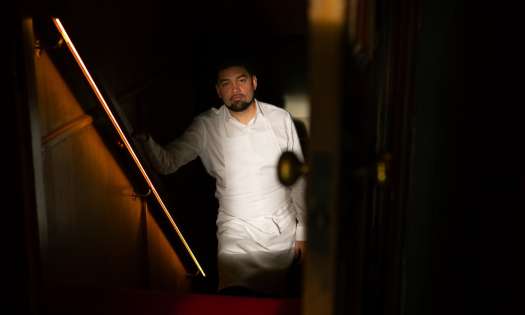 Luke selby posing on stairs .