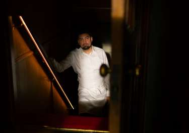 Luke selby posing on stairs .