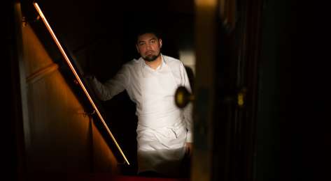Luke selby posing on stairs .