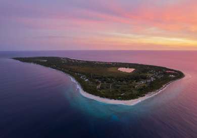 Island in the maldives with sunset.