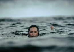 Woman wild swimming.
