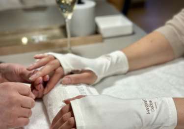 Photo of person getting a manicure.