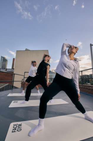 Three people doing yoga.