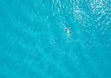Person swimming in the sea.
